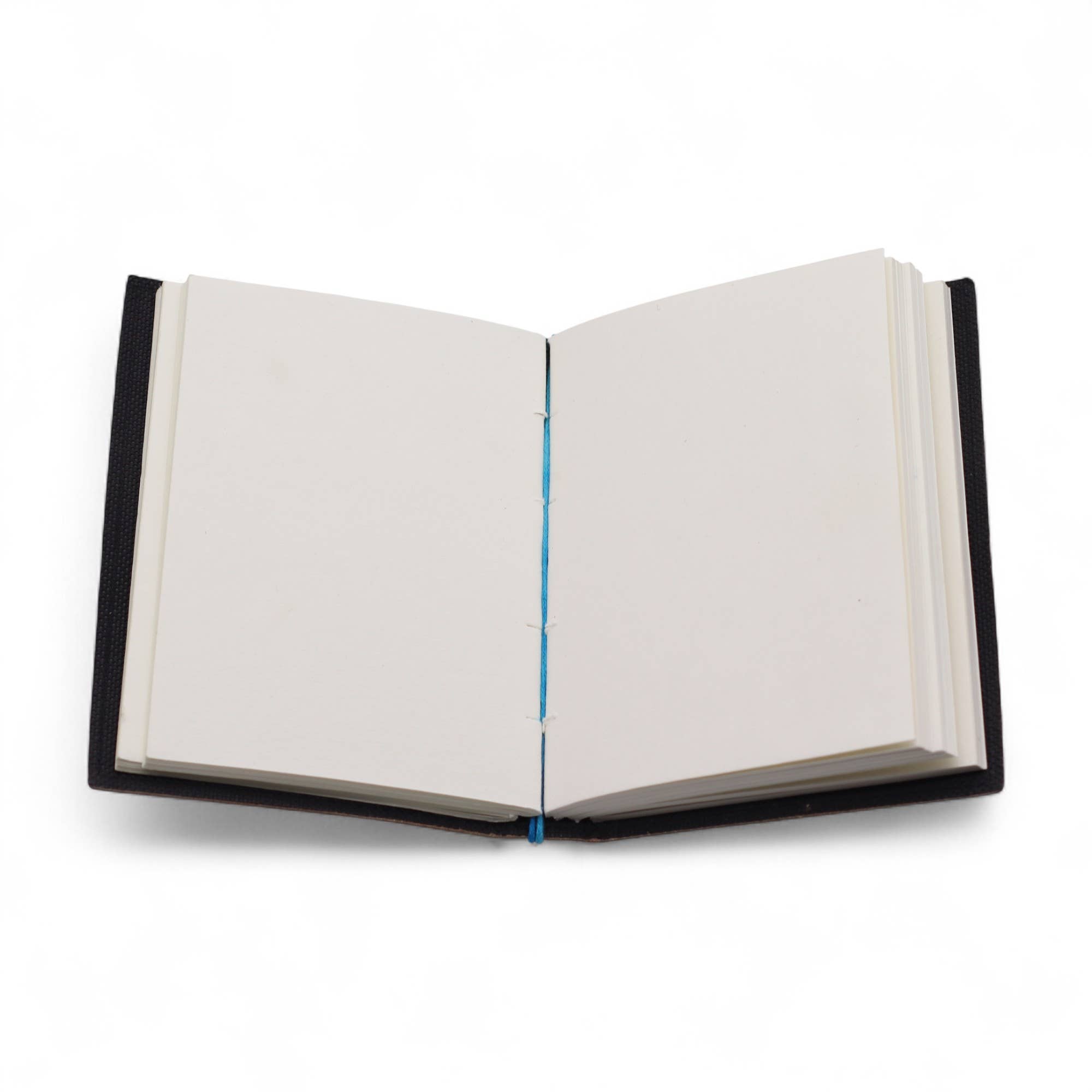 Open notebook with black leather binding on a white background
