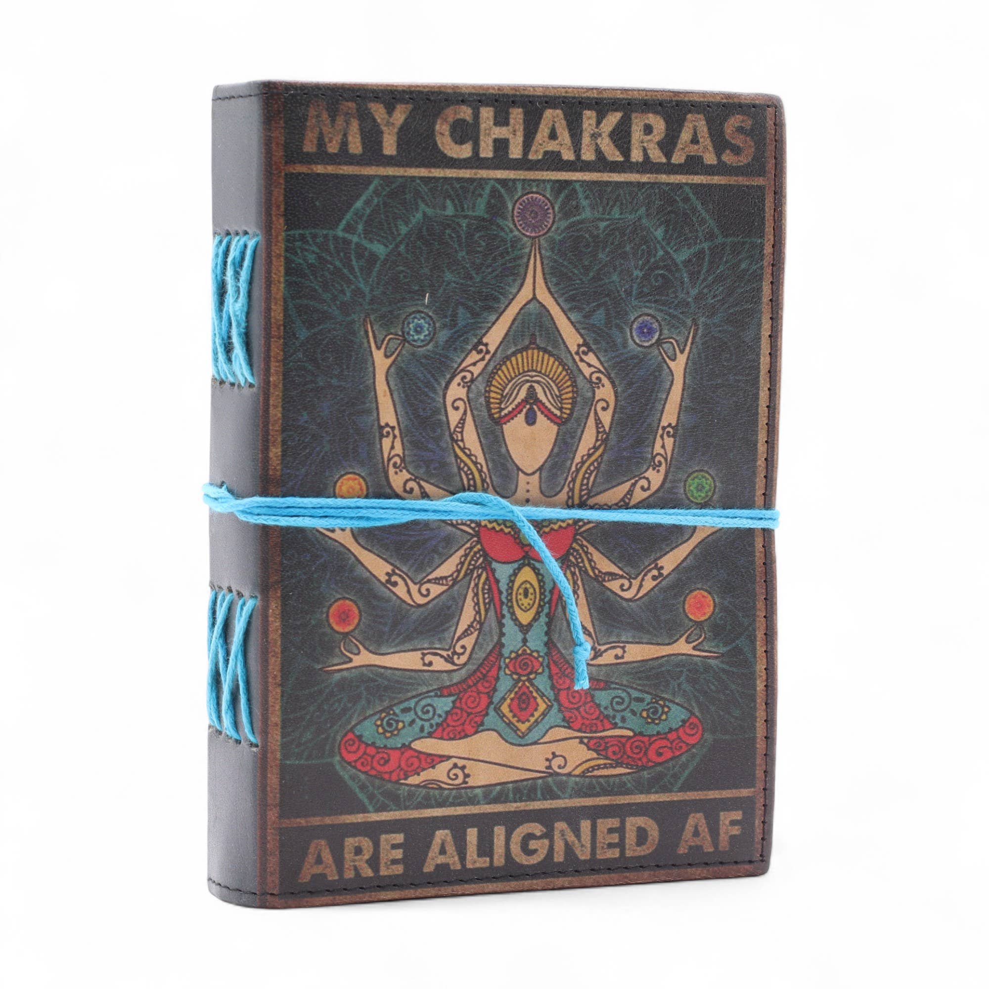 Journal with chakra design and text 'My Chakras Are Aligned AF' on a white background